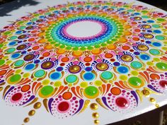 an artistically painted table with circles and dots on it