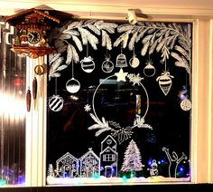 a window decorated with christmas decorations and ornaments