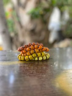 10 Ceramic Bead Bracelets within your selected color story. Color Options: Vibrant - Bright, Fun Primary Colors Pastel - Soft, Beautiful Pastel Tones Neutral - Blacks, Browns, Creams and Whites. Other color stories available as listed. Choose "Assortment" to receive a mix of all color profiles! Yellow Stackable Beaded Bracelets, Adjustable Orange Stackable Beaded Bracelets, Adjustable Stackable Orange Beaded Bracelets, Stackable Orange Round Beaded Bracelets, Orange Stackable Bracelets With Round Beads, Orange Stackable Round Bead Jewelry, Orange Stackable Jewelry With Round Beads, Orange Bracelets With Wooden Round Beads, Scene Jewelry