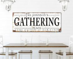 a dining room table with four chairs and a sign on the wall above it that says, the johnson's gathering place