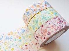 two rolls of washi tape with flowers on them