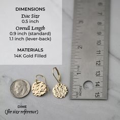 These luxurious hand crafted shiny gold filled statement earrings are meticulously hammered for a subtle sparkle and are paired with secure elegant standard or hinged lever-back ear wires. They are equally happy to be paired with everyday jeans or a dress. Earring discs are 1/2 inch. Overall earring length is 0.9 inch (standard) or 1.1 inch (lever-back). All components are 14K gold filled. Standard earwires come with a set of clear stoppers to prevent loss. Choose from standard or hinged lever-b Adjustable Hammered Minimalist Earrings, Hammered Minimalist Adjustable Earrings, Minimalist Hammered Adjustable Earrings, Brass Earrings With Lever Back Ear Wires, Minimalist Round Earrings With French Hook, Everyday 14k Gold Filled Earrings With French Hook, Everyday Hammered 14k Gold Filled Earrings, Hammered Adjustable Drop Earrings, Dainty Adjustable French Hook Earrings