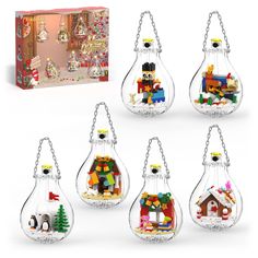 a set of six glass ornaments with legos in them