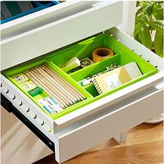 an open drawer with various items in it