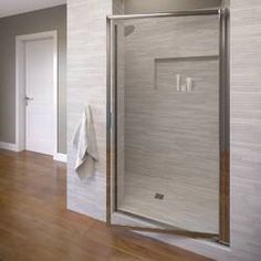 a bathroom with a shower and wooden floors