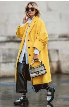 Elegant Yellow Winter Outerwear, Trendy Oversized Yellow Outerwear, Yellow Oversized Outerwear For Fall, Elegant Yellow Outerwear With Pockets, Oversized Yellow Outerwear For Fall, Yellow Long Coat For Fall, Oversized Yellow Outerwear For Spring, Yellow Long Coat For Winter, Chic Yellow Single Breasted Outerwear