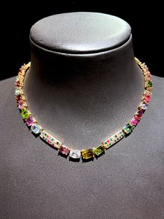 This gorgeous array of colors will get everyone's attention. The assortment of tourmalines ranging from yellow, pink, violet, and green colors are arranged in a non-systematic order with multicolor sapphire bars intermittently . The tourmalines are various shapes - pear, oval, radiant, and cushion cut. This colorful, easy to wear necklace is perfect for spring and dummer and will go perfectly with your outfits. This is a must have, one of a kind piece! Tourmalines: 53.00 cts, Pear, Oval, Radiant Vintage Choker, Wear Necklaces, Tourmaline Necklace, Choker Necklaces, Cushion Cut, Green Colors, Tourmaline, Choker Necklace, Violet