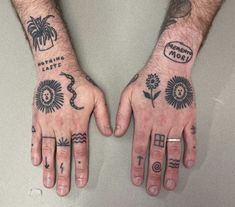 two hands with different tattoos on them