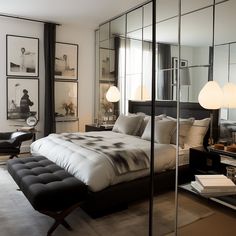 a bedroom with mirrored walls and a large bed