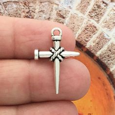 BULK 40 Silver Nail Cross Charm Pendant by TIJC SP1103B Etsy Silver cross charm, Cross Nails Charms, Nail Cross Necklace, Nail Cross, Cross Nails, Silver Nail, Christian Fashion, Silver Cross Pendant, Silver Nails, Brown Nails