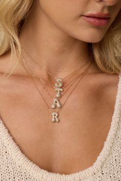 14kt gold-plated chain with Pavé monogrammed plated charm. Letters available Necklace measure 16" with 2" extender. Letter charms available in the full alphabet, letters A-Z. Letters size and shapes will vary. Trendy Initial Pendant Charm Necklaces, Dainty Gold Charm Necklace With Letter Beads, Personalized Gold Charm Necklaces With Letter Beads, Personalized Gift Charm Necklace With Initial Pendant, Monogram Initial Pendant Name Necklace, Gold Charm Necklace With Initial Pendant And Letter Beads, Gold Charm Necklace With Letter Beads Initial Pendant, Gold Monogram Necklace In Trendy Style, Trendy Gold Monogram Necklace