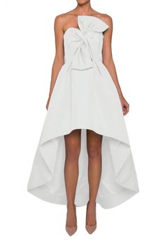 Silk Faille Twisted Bow High-Low Gown | Over The Moon Luxury Fitted High-low Wedding Dress, Luxury Fitted High Low Wedding Dress, Luxury High-low Hem Dress With Ruffles, Luxury High Low Dress With Asymmetrical Hem, Luxury Elegant High-low Wedding Dress, Luxury Full-skirt Dress With Pleated Back, Luxury Elegant High Low Dress With Asymmetrical Hem, Luxury Fitted High-low Hem Dress, Luxury High-low Hem Lined Skirt