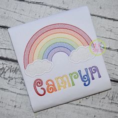 a white shirt with the word rainbow on it