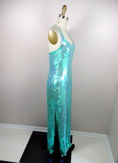 "This is a JAW-DROPPING vintage gown! It's fully embellished with iridescent sequins and in perfect condition! Measurements: Bust - 34\" Waist - 27\" Hips - 36\" Length - 59\" This item comes from a pet-free and smoke-free home. If you would like more info or have any questions, please don't hesitate to ask!" Glamorous Mermaid Gown For Party Season, Glamorous Mermaid Sequin Dress For Wedding, Glamorous Sequined Mermaid Cocktail Dress, Fitted Floor-length Sequin Dress With Shimmer, Glamorous Mermaid Sequin Dress For Prom, Glamorous Sequined Mermaid Dress For Party Season, Full-length Sequined Evening Dress For Party Season, Sequin Full-length Evening Dress For Party Season, Party Season Sequined Maxi Dress With Mermaid Hem