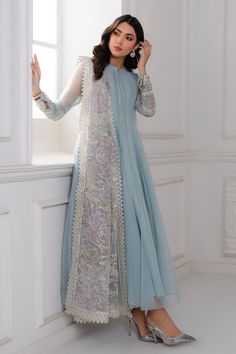 Pakistani Party Frock With Dupatta In Sky Blue Color is a classic combination of off white & sky blue that comes jointly in this design etched with antique sequins rendering that give luxurious feel. The shirt is hemmed with double embellished heavy borders on two colors balancing the overall look. It comes with dyed pants & an interesting dual-colored heightened organza dupatta creating an eye-catching floral pattern. Detailed Description: SKU: PB005 Detailing: Embroidery, Threads, Floral desig Desi Outfits, Long Anarkali, Pakistani Fancy Dresses, Pakistani Dresses Casual, Beautiful Pakistani Dresses, Salwar Kamiz, Indian Dresses Traditional, Fancy Dresses Long, Simple Pakistani Dresses