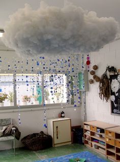 a room with clouds hanging from the ceiling