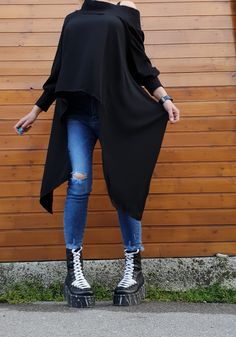 "Extravagant Black Tunic with Open Back, Casual Women Black Tunic, Asymmetric Tunic, Oversized Loose Tunic, Plus Size Blouse, Avant Garde Top ❤️ Extravagant designs and high quality fabrics! ❤️ Materials & Care Textile Hand wash at low temperatures. Do not machine dry. Do not iron. Do not dry clean! ❤️ Sizing We can make your piece from XS to 5XL! Everything in the shop can be also made according to your measures free of charge! ❤️ Shipping ✈ Ready to ship The time I need to prepare an order Black Lagenlook Blouse With Asymmetrical Hem, Black Asymmetrical Chic Tunic, Chic Black Asymmetrical Tunic, Queer Style, Asymmetric Tunic, Loose Tunic, Plus Size Blouse, Queer Fashion, Black Tunic