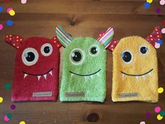 three towels that have been made to look like monsters