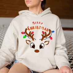 "Merry Christmas Reindeer Hoodie, Cute Reindeer, Christmas Reindeer Tree, Family Gift Shirt, Matching Shirt, Xmas Shirt, Cozy Winter Tee  It will be cozy winter season thanks to Merry Christmas Reindeer Hoodie. Welcome to the different, crazy and colorful world of ORANGE WORLD :) PRODUCT DETAILS - Relaxed fit - Unisex - 50% cotton 50% polyester - 1 x 1 rib with spandex - Double-lined hood with colour-matched drawcord (Youth Hoodies do not have drawcord for added safety) - Pouch pocket HOW TO ORD Reindeer Christmas Family Shirts, Christmas Reindeer Shirt, Reindeer Shirts For Kids, Reindeer Jumper, Reindeer Christmas Tshirt Unisex, Winter Tees, White Reindeer, Xmas Shirts, Youth Hoodies