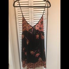 Free People Boho Beach Dress Black Floral Black Bohemian V-neck Sundress, Black Spaghetti Strap Dress For Beach Season, Black Spaghetti Strap Dress For Beach, Black Spaghetti Strap Mini Dress For Beach Season, Black Floral Print Beachwear Dress, Black Floral Print Beach Dress, Black Beachwear Sundress For Vacation, Black Sundress For Beach Season, Black Sundress For The Beach