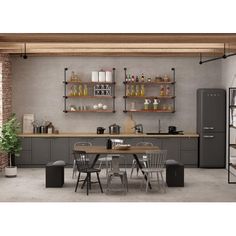 an industrial style kitchen and dining room with grey cabinets, black appliances and wooden floors