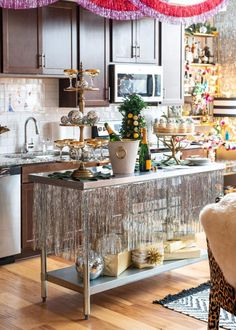 a kitchen filled with lots of clutter and decor