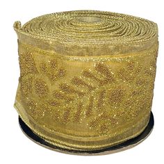 a roll of gold sequinized ribbon on a white background