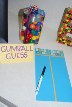 the gumball guess game is next to some candy