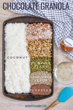 ingredients for chocolate granola laid out in a baking pan on a wooden table with text overlay