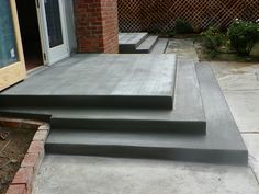 concrete steps leading up to an open door