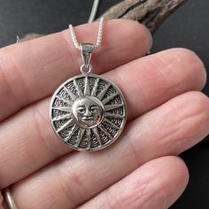 sterling silver sun disc necklace pendant Symbolic Jewelry With Sun Design Round Pendant, Symbolic Round Pendant Jewelry With Sun Design, Symbolic Sun Design Round Pendant Jewelry, Silver Sunburst Jewelry For Gifts, Sterling Silver Sun Design Necklace, Sterling Silver Sunburst Jewelry With Sun Design, Silver Medallion Necklace With Sun Design, Sterling Silver Sunburst Jewelry, Silver Sunburst Necklace For Gift