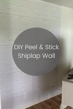 a white wall with the words diy peel and stick shiplap wall on it