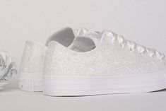 We have upgraded our production and shipping times.Now you can get your Wedding Converse faster than ever. 1-2 weeks production time guaranteed. Standard shipping transit times : USA 2-4 business days (Express at no extra cost) Made with love for your wedding day by Lovin Bridal - More Wedding shoes at our shop : http://lovincollection.etsy.com White Glitter Wedding Shoes For Bride, White Glitter Converse For Bride, Awesome Bridal Shoes For Destination Wedding, Reception Shoes It's the bride's p Silver Sneakers For Wedding With Round Toe, White Low-top Wedding Shoes For Bridal Shower, Silver Lace-up Sneakers For Wedding, Silver Lace-up Wedding Shoes, White Sparkling Wedding Shoes For Formal Occasions, Formal Sparkling White Wedding Shoes, Formal White Sparkling Wedding Shoes, White Low-top Wedding Shoes, Low-top Glitter Sneakers For Wedding