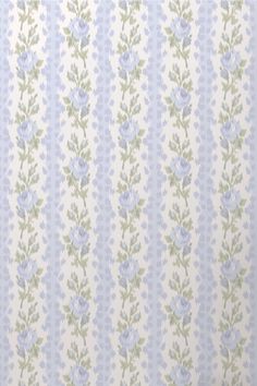 a blue and green striped wallpaper with small flowers on the bottom half of it