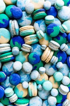 blue and green macaroons are scattered together