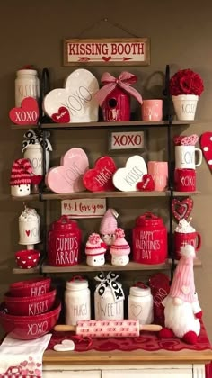 valentine's day display with red and white dishes, mugs and hearts on shelves