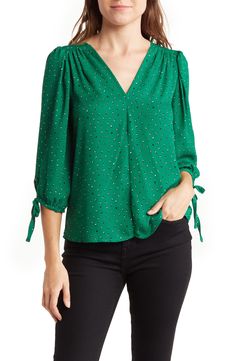 Artistic dots printing accentuates a lightweight top that is framed by a V-neckline and bracelet-length sleeves. 23" length (size S) V-neck Bracelet-length sleeves 100% polyester Hand wash, line dry Made in the USA of imported fabric Model stats: 5'10" height, 32" bust, 25" waist, 36" hip. Model is wearing size S. Blouses For Women Nordstrom, Macys Womens Tops, Neck Bracelet, Burmese Clothing, Tie Sleeve Blouse, Plus Size Dress Outfits, Fancy Dresses Long, Women Blouse, Tie Sleeve