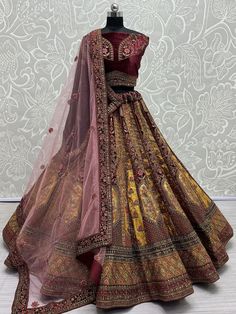 This exquisite ensemble features intricate dori work, multi-thread work, patchwork, zari work, sequin work, and diamond work, making it a true masterpiece. The maroon and golden color combination exudes elegance and luxury, perfect for your special day.
This bridal lehenga set is truly unique and eye-catching. From the exquisite dori work to the shimmering sequin work, every detail has been carefully crafted to ensure you stand out on your wedding day. The semi-stitched lehenga can fit up to 42 Traditional Embroidered Sets For Reception, Embroidered Multicolor Traditional Sets For Reception, Traditional Multicolor Embroidery Sets For Reception, Navratri Brocade Choli With Intricate Embroidery, Gold Lehenga With Resham Embroidery For Transitional Season, Anarkali Sets With Gold Embroidery For Transitional Season, Diwali Brocade Choli With Intricate Embroidery, Festival Brocade Choli With Resham Embroidery, Red Embroidered Brocade Lehenga