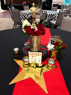 a table set up with flowers, candles and decorations for a celebration or special occasion