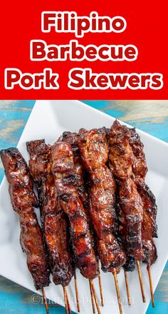 grilled pork skewers on a white plate with text overlay