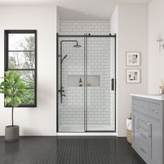 a bathroom with black and white tile flooring