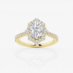 a yellow gold engagement ring with an oval diamond center