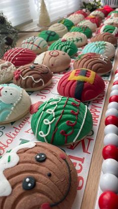 decorated cookies are lined up on a table