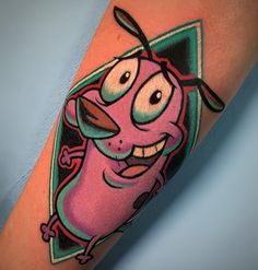 a cartoon character tattoo on the arm