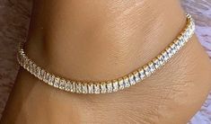 This beautiful anklet features brilliant crystals and gold links in a geometric design. It will add an elegant touch to your ankle. This piece detaches at the back of the ankle with a round latch. And is size adjustable. Comfortable and versatile, it will lend itself to casual or formal events. My anklets are sold individually and are one size fits all. All items are made in a smoke free environment. *If there is any issue with your footwear, please let me know so that I can correct it. Thanks for visiting my shop!👣 Elegant Gold Crystal Anklets, Adjustable Crystal Anklets In Elegant Style, Elegant Crystal Anklets With Adjustable Fit, Gold Anklets With Rhinestones For Party, Gold Rhinestone Anklets For Party, Party Gold Anklets With Rhinestones, Gold Rhinestone Party Anklets, Adjustable Gold Crystal Anklets, Elegant Bling Anklets For Party