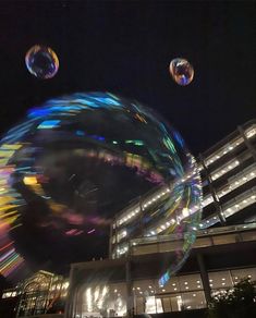 some bubbles floating in the air near a building