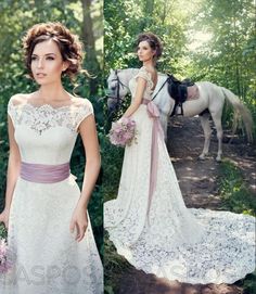 a woman in a white dress standing next to a horse