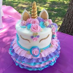 there is a cake decorated like a unicorn