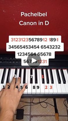 a person is playing the piano with numbers on it and an ad for canon in d