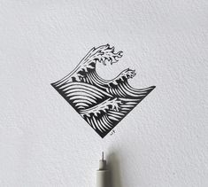 an ink drawing of a wave in black and white on a piece of paper with a pen